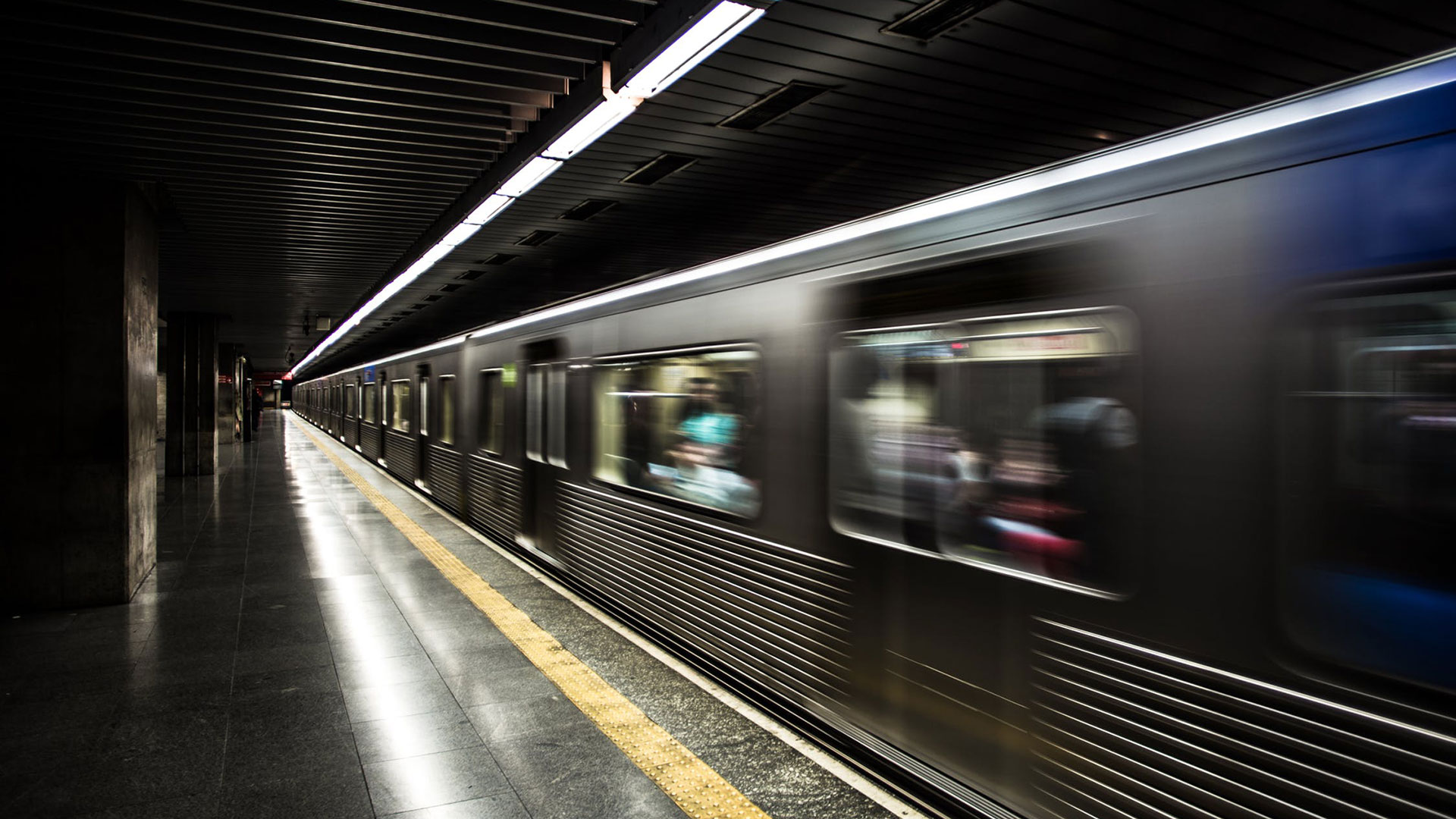 Time lapse photo of subway traveling through a station