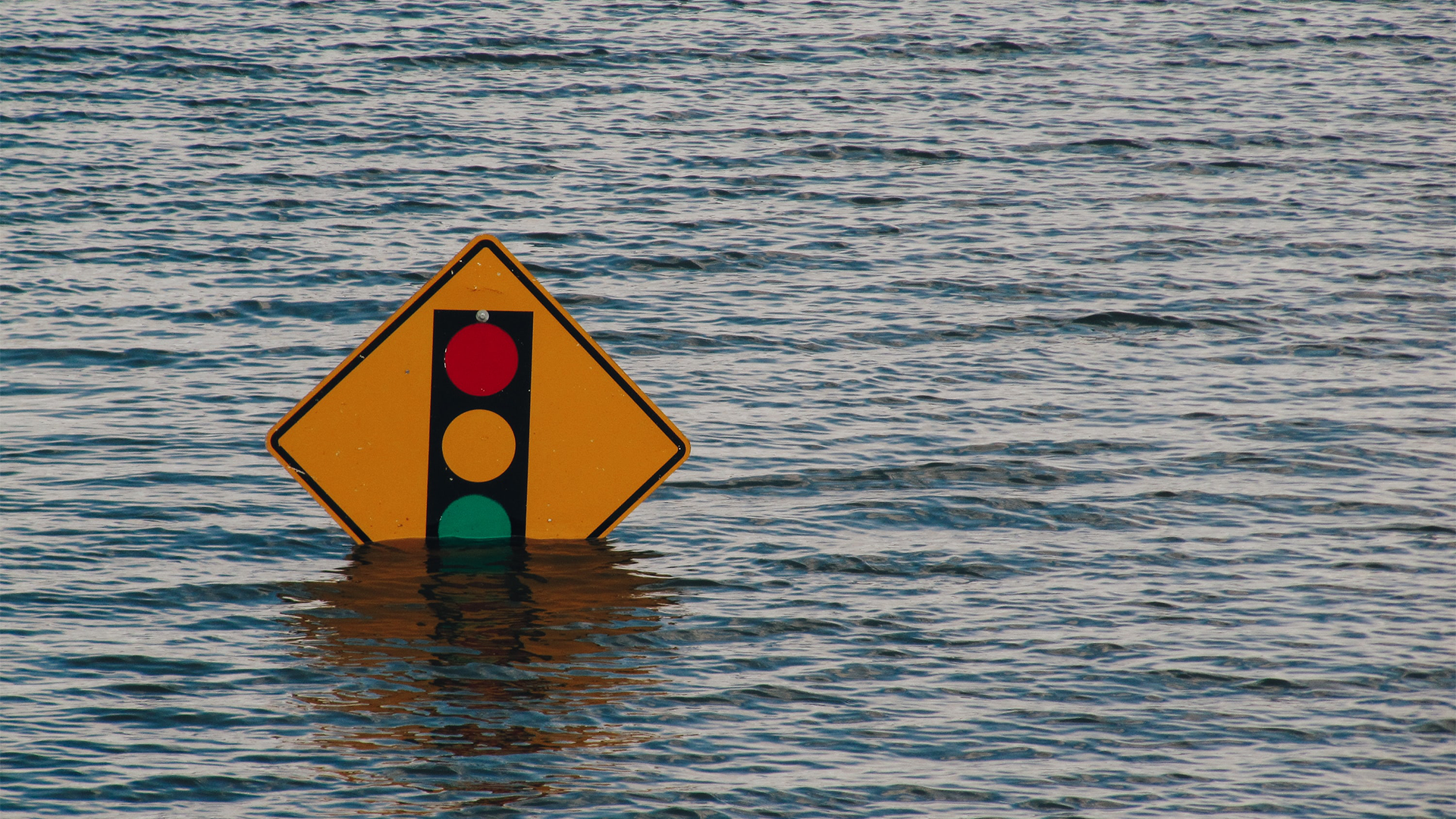 Traffic sign almost covered by flooding