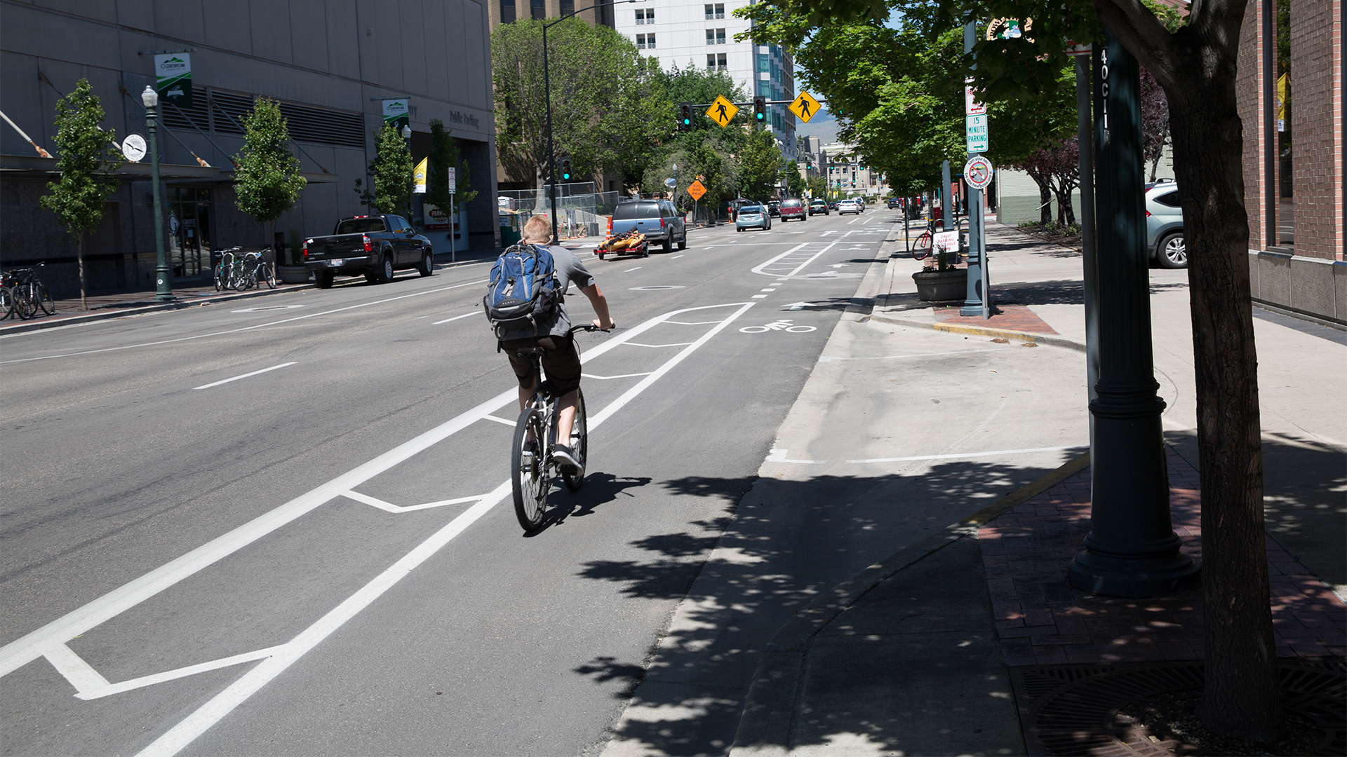 A person biking in a bike lane.