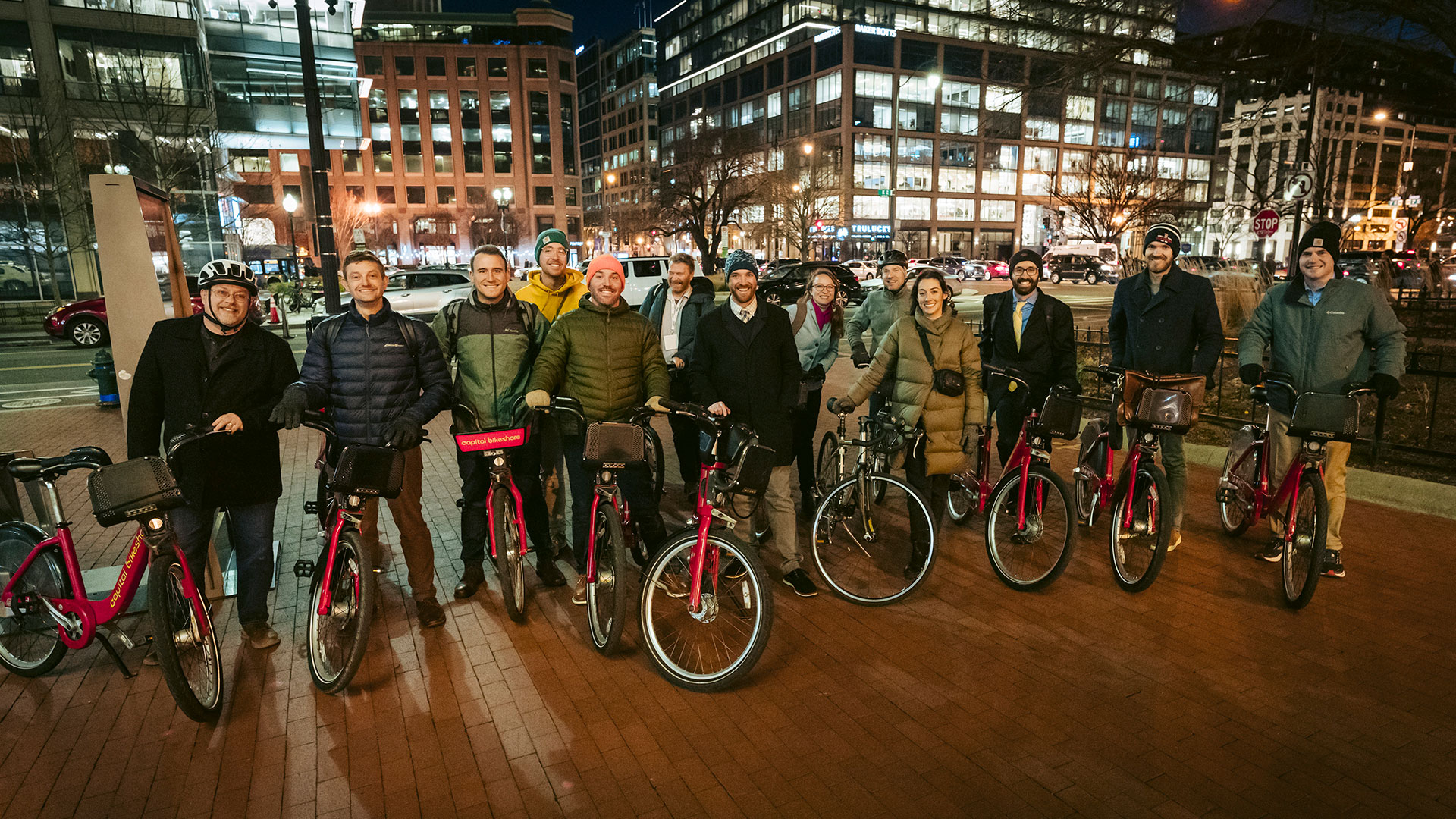 Group of Kittelson team members with bikes in downtown Washington, D.C.