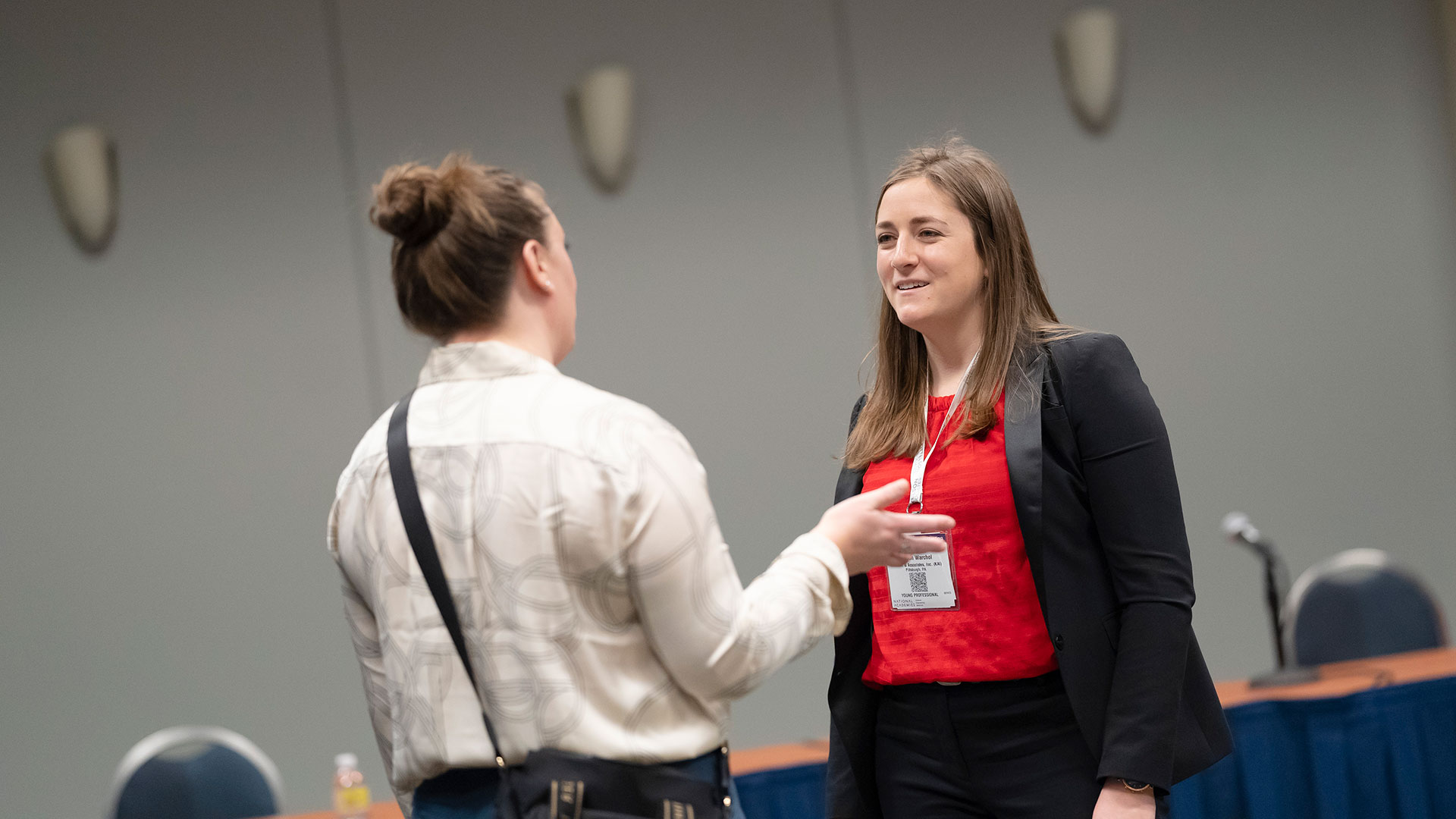 Two women having a conversation at the 2023 TRB Annual Meeting