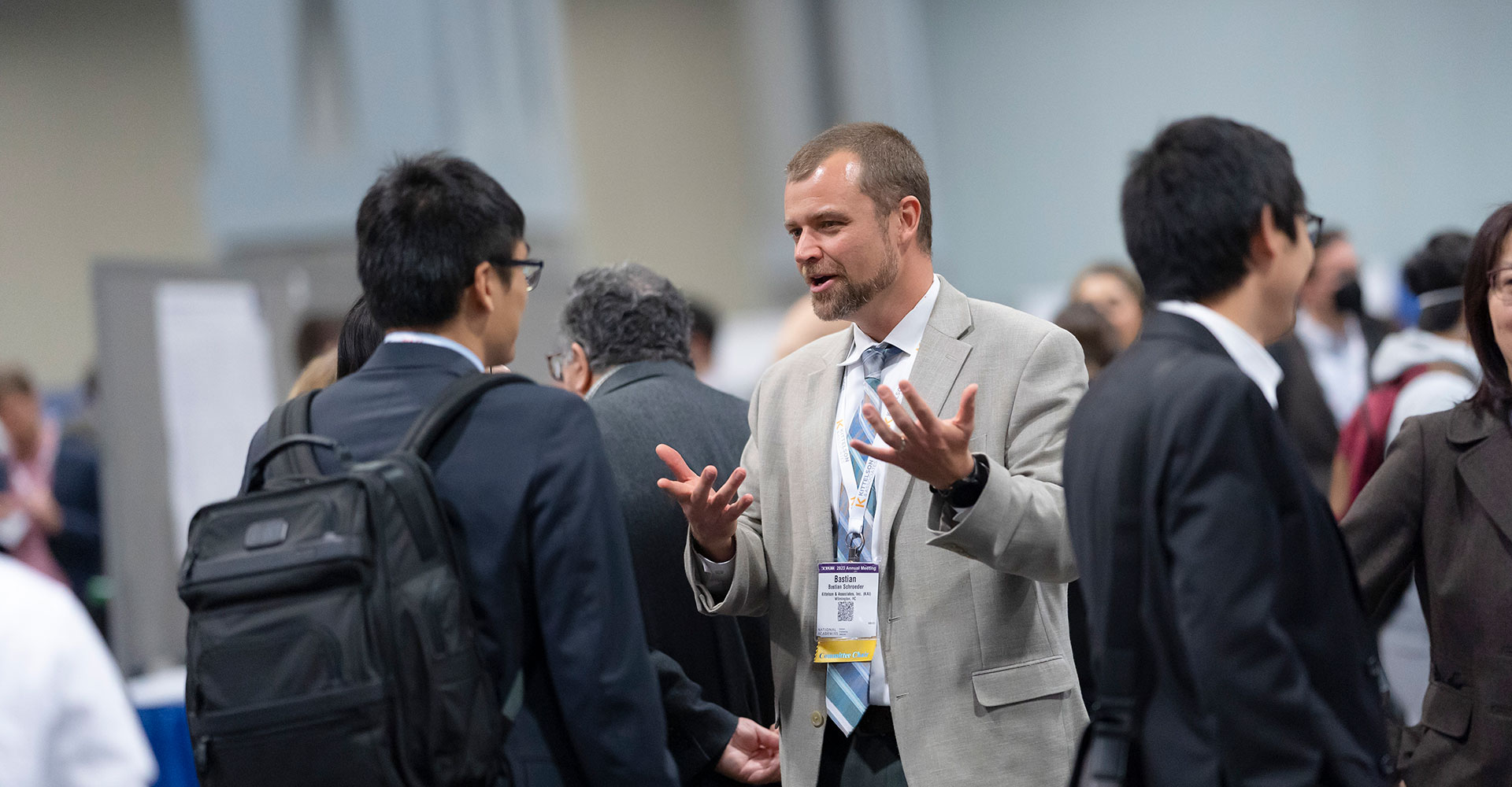 Two men discussing a poster at the 2023 TRB Annual Meeting