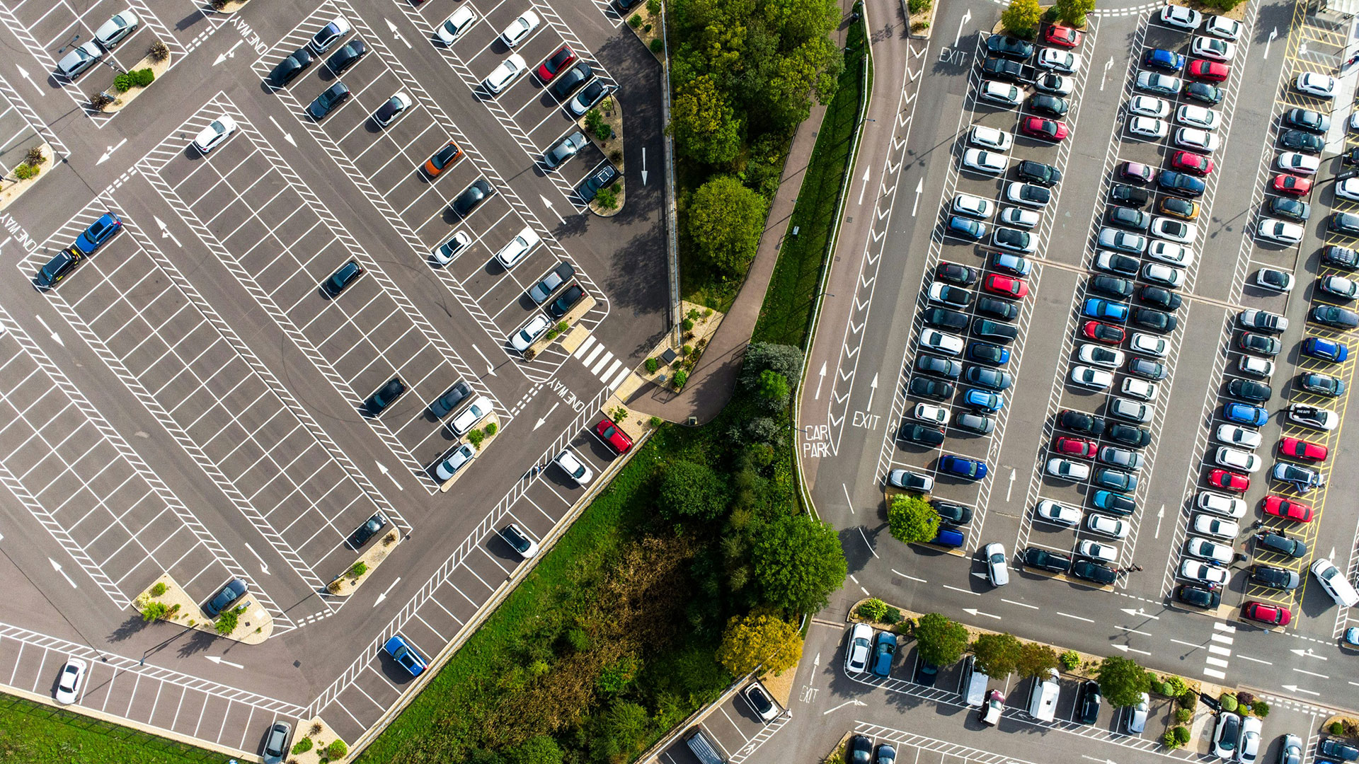 Aerial shot of a partially full parking lot