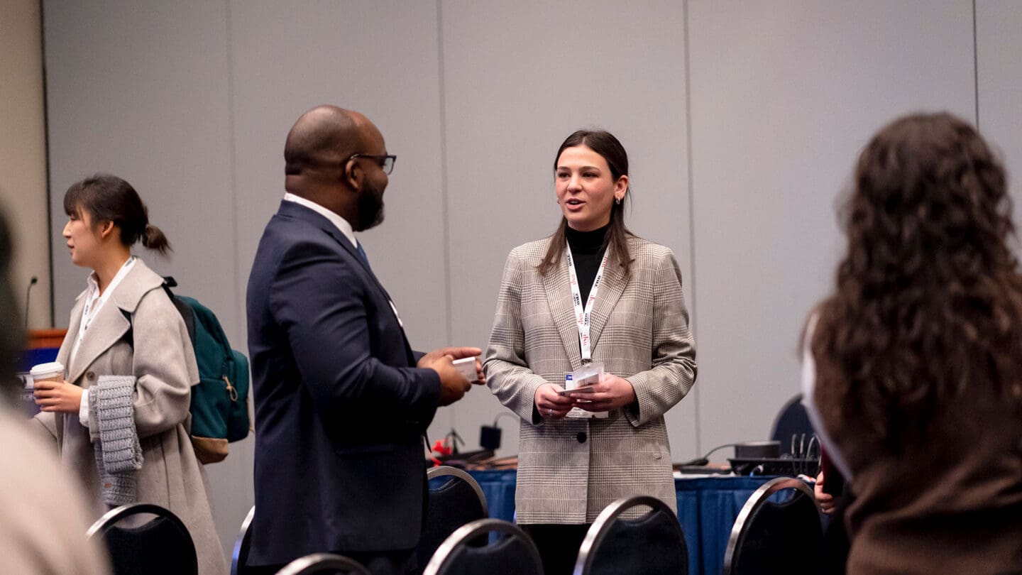 Two people talking at a lectern session at a TRB Annual Meeting