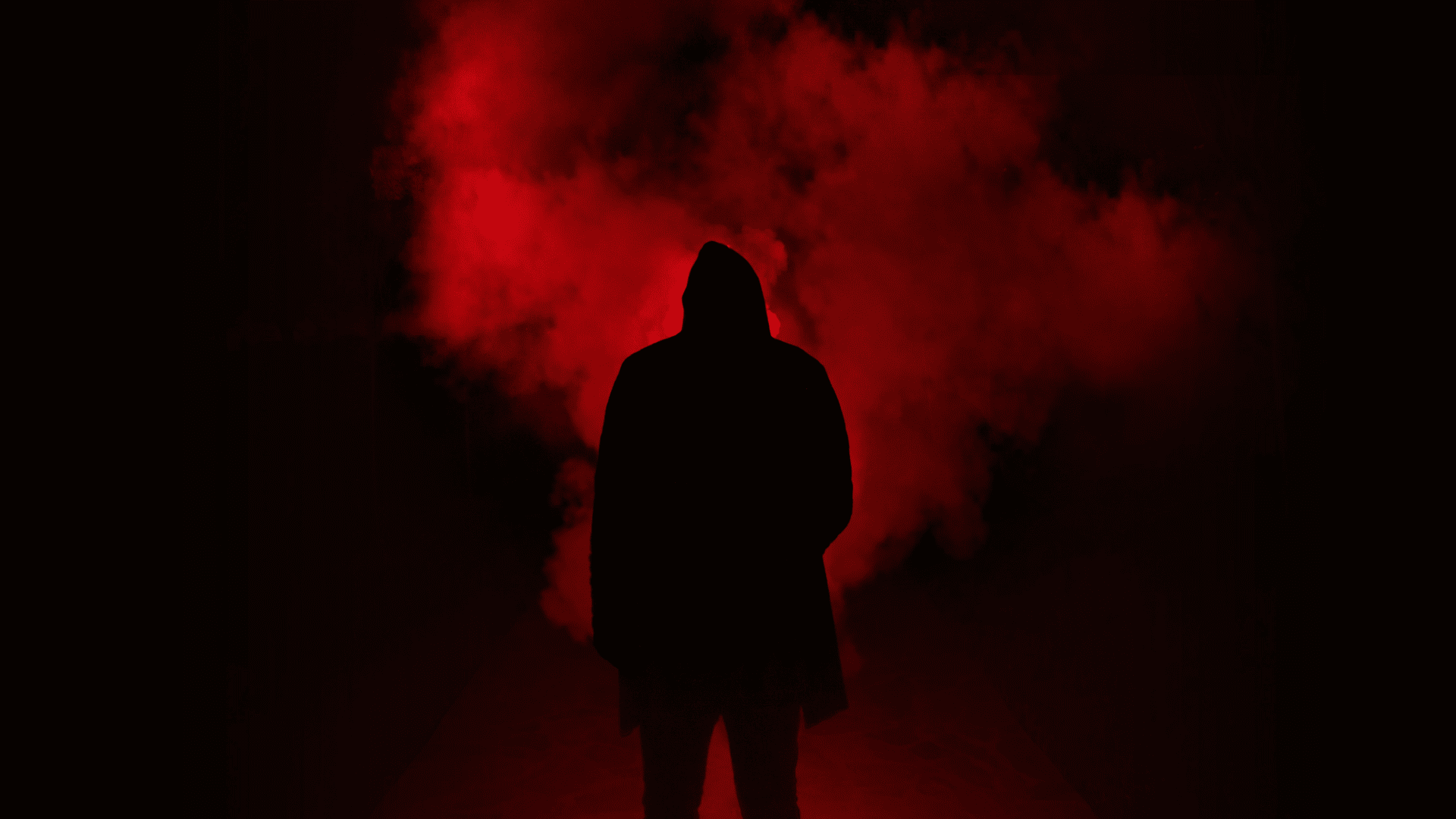 Dark figure with red smoke in the background