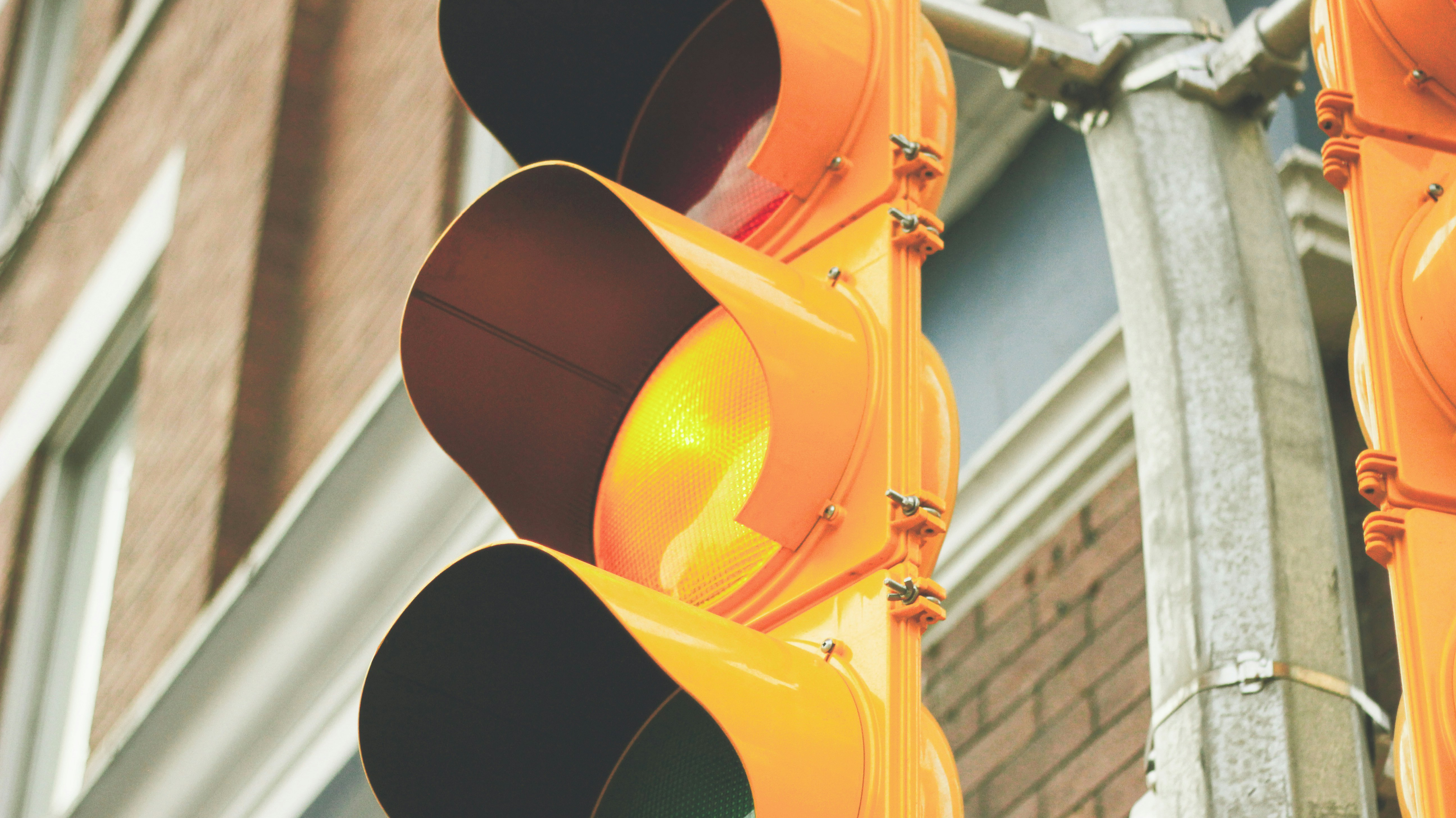 Close up of traffic signal with yellow light